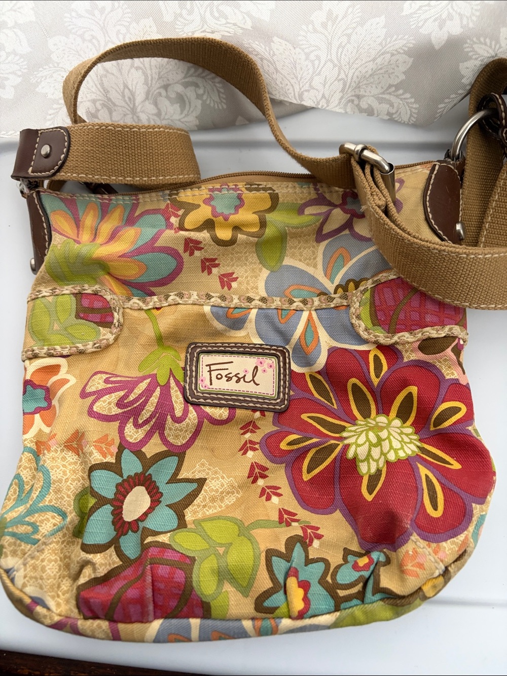 Fossil Floral Crossbody Bag in Tan with Red, Blue and Green Accents